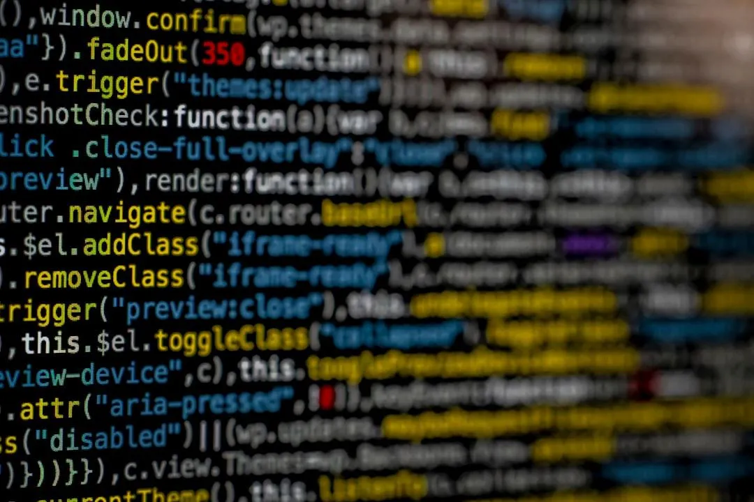 Close-up of software source code displayed on a screen