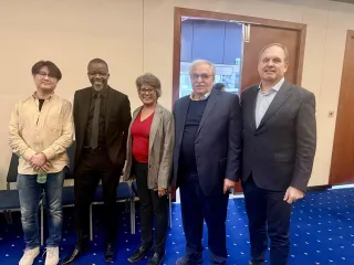 Group of attendees posing together at an industry event
