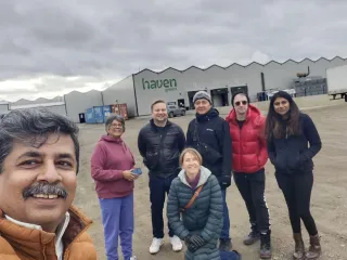 Group photo outside a facility building